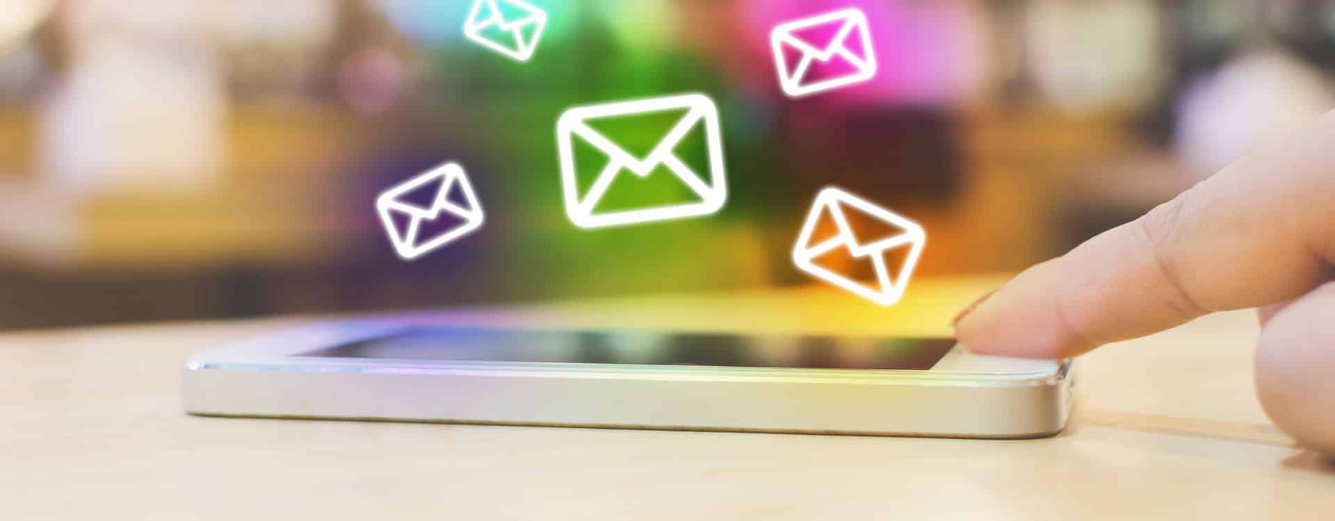 Woman hand using mobile phone with e-mail application, Concept email marketing and newsletter